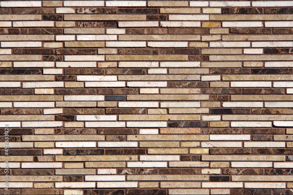 Full frame close-up view of a building wall with marble strips in various colors Full frame close-up view of a building wall with marble strips in various colors