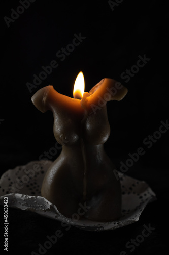 candle in the shape of a female body, smoke