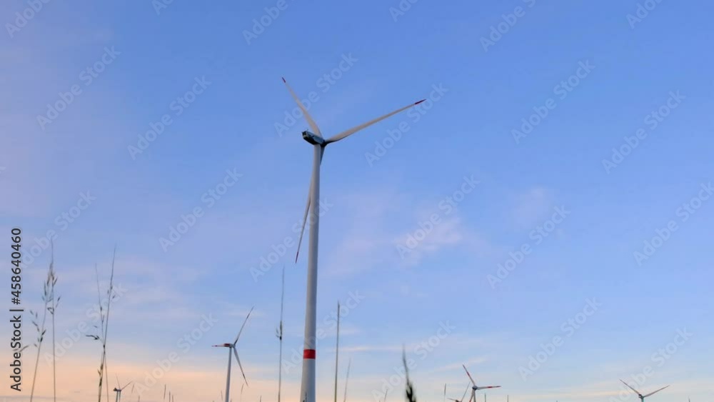 Wind turbines in field. Natural energy.Alternative energy sources. Environmentally friendly energy source. Wind energy day holiday. Wind turbines in field. Natural energy.Alternative energy sources. Environmentally friendly energy source. Wind energy day holiday.
