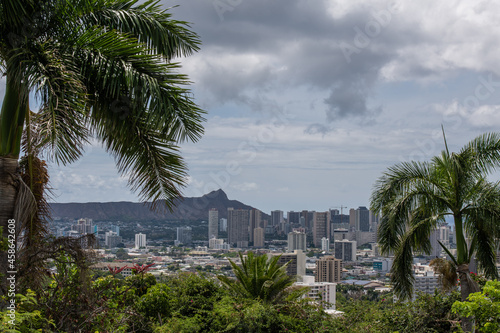 Scenic aerial Honolulu vista with the Diamond Head in the background on a rainy day, Oahu, Hawaii © Alex Krassel