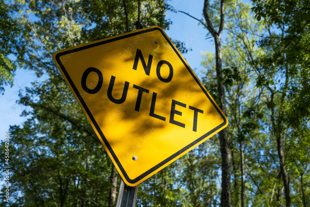 No Outlet Road Sign near Wooded Forest