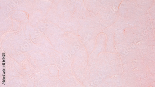 ピンクの手漉き和紙の背景素材
