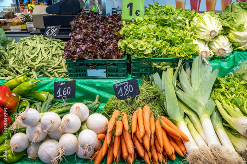 Radish, carrots and leek for sale at a market