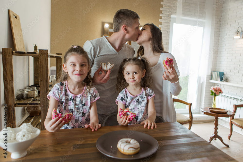 the family eats cakes. dinner at the bakery. feast in the kitchen. the butchering of the food. the family eats cakes. dinner at the bakery. feast in the kitchen. the butchering of the food.
