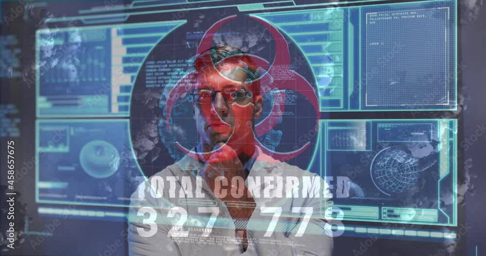 Animation of biohazard icon, virus cells, digital interface over male doctor Animation of biohazard icon, virus cells, digital interface over male doctor