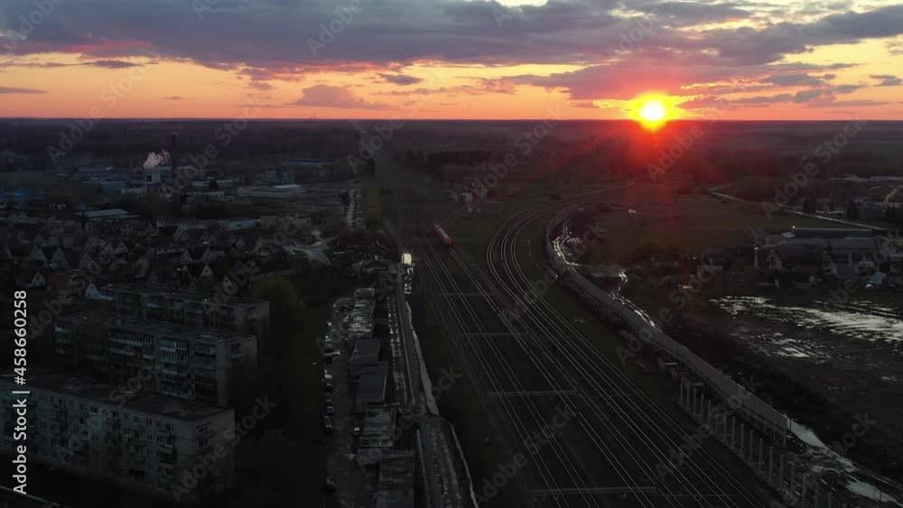Drone aerial view of train in the evening. Drone aerial view. Kaisiadorys, Lithuania Drone aerial view of train in the evening. Drone aerial view. Kaisiadorys, Lithuania