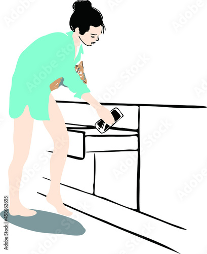 A sexy girl wearing an oversized shirt and barefoot holding a cat in her left hand, is putting down her phone in the drawer, which means stay away from the phone or unplugging it for a while.