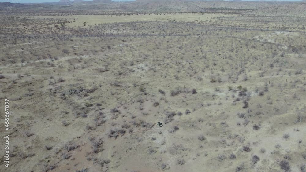 Truck Driving through Etosha National Park in Namibia, Africa - Aerial Truck Driving through Etosha National Park in Namibia, Africa - Aerial