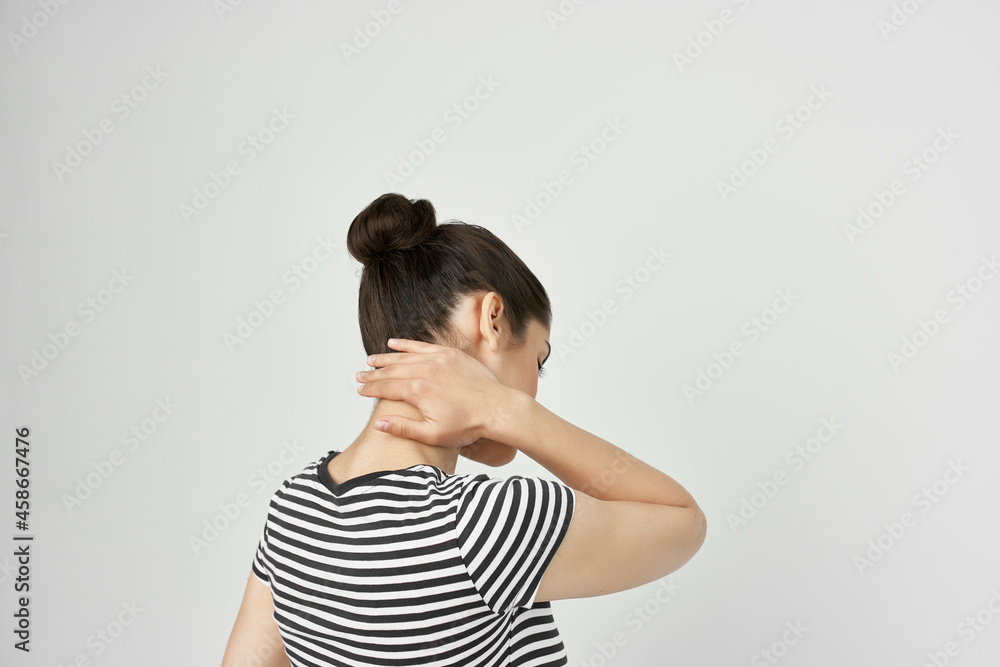 brunette holding his head migraine depression light background brunette holding his head migraine depression light background