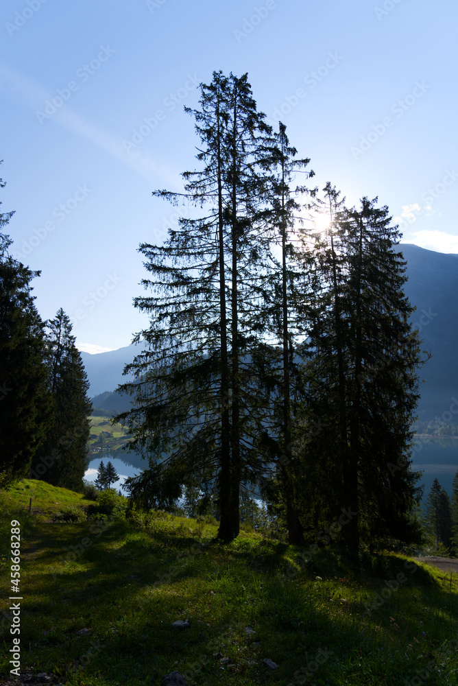 Fototapeta premium Lake Klöntal at a beautiful late summer morning with reflections in calm water. Photo taken September 4th, 2021, Klöntal, Switzerland.