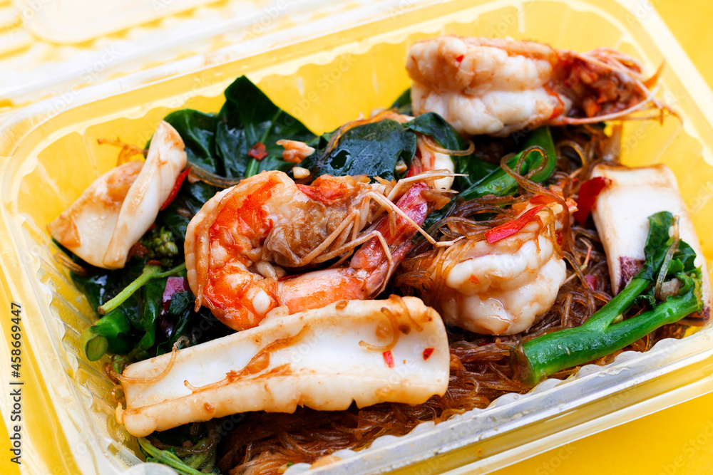 Spicy stir fried vermicelli with holy basil leaves and sea food