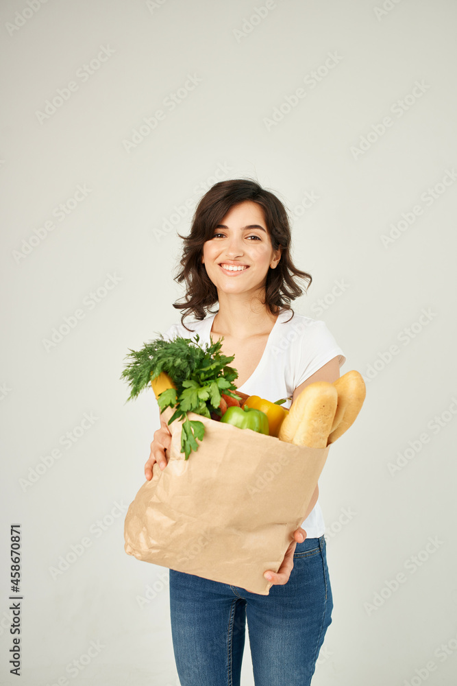 woman with package of groceries delivery service woman with package of groceries delivery service
