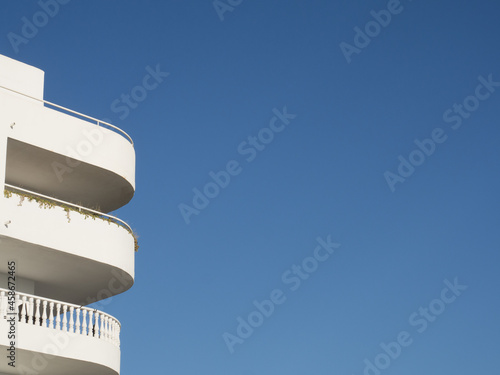 Modern white building with copy space over blue sky