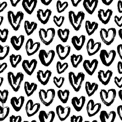 Vector pattern with black hearts. Linear silhouettes of hearts hand-drawn in charcoal. Romantic ink illustration. Black-white seamless pattern for Valentine s Day. Simple repeating chaotic texture.
