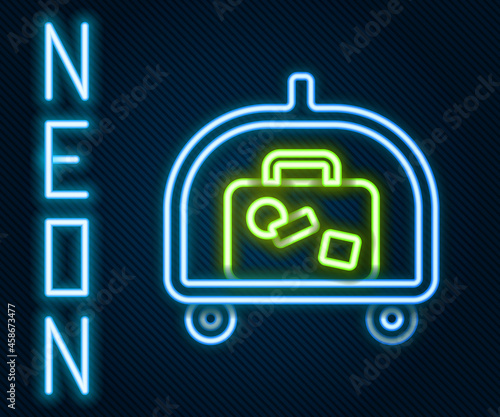 Glowing neon line Hotel luggage cart with suitcase icon isolated on black background. Traveling baggage sign. Travel luggage icon. Colorful outline concept. Vector