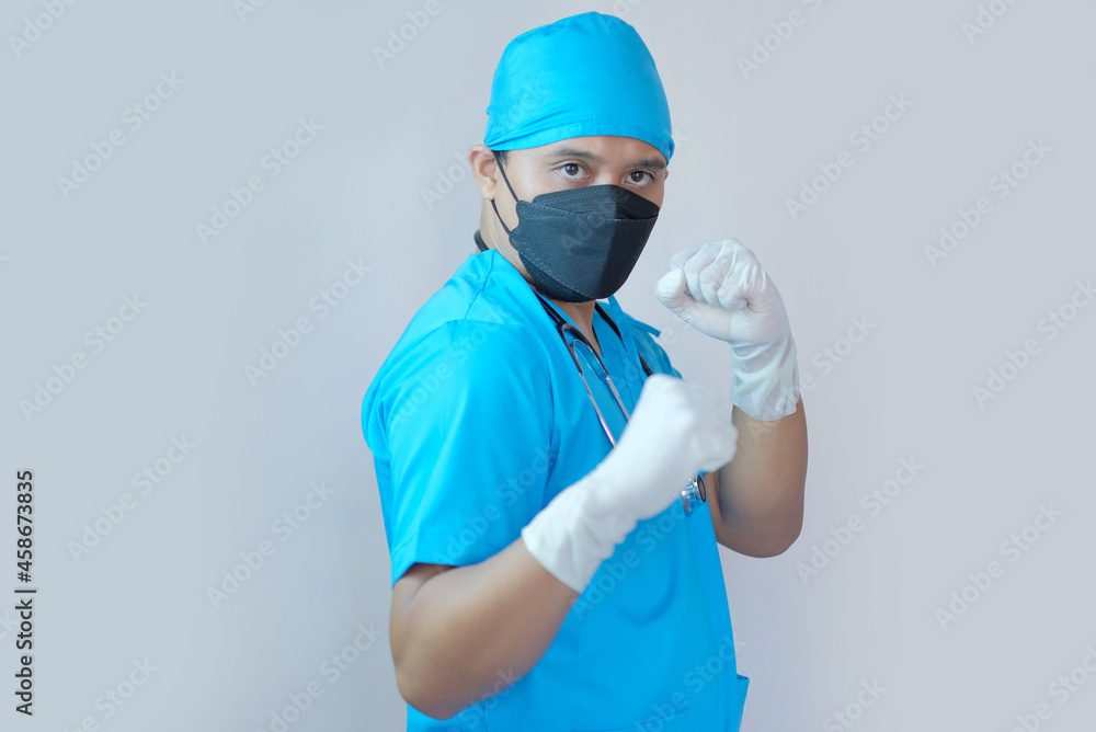 portrait of male doctor clenched fist portrait of male doctor clenched fist