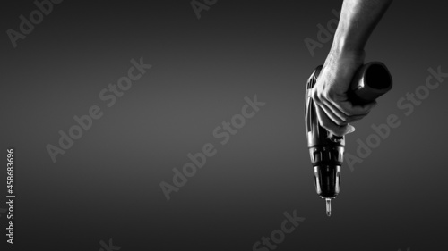 Hand holding a cordless screwdriver © photoschmidt