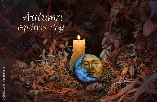 Autumn equinox day. burning candle, symbol of sun and moon, autumn leaves on abstract dark background. pagan Wiccan, Slavic traditions. Witchcraft, esoteric spiritual ritual for mabon