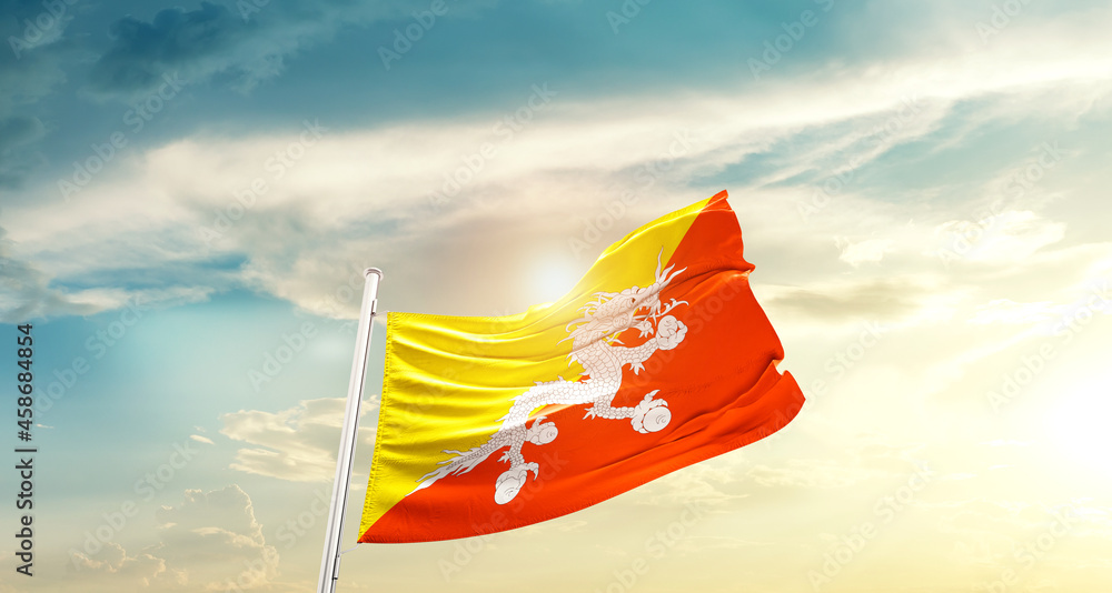 Bhutan national flag cloth fabric waving on beautiful sky - Image