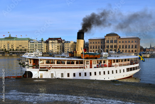 Obraz na plátně Shot of a white ship emitting black smoke in the National Museum in Stockholm, S