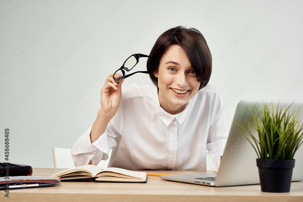 Businesswoman at the desk with glasses self-confidence Studio Lifestyle Businesswoman at the desk with glasses self-confidence Studio Lifestyle
