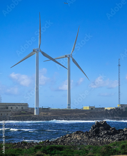 Wind turbines by the sea in Corralejo, Fuerteventura, Canary Islands, Spain
