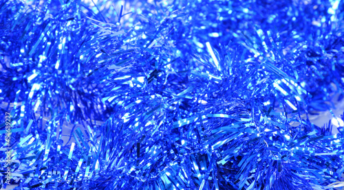 Tinsel is blue. New Year's tinsel. Suitable for backgrounds.
