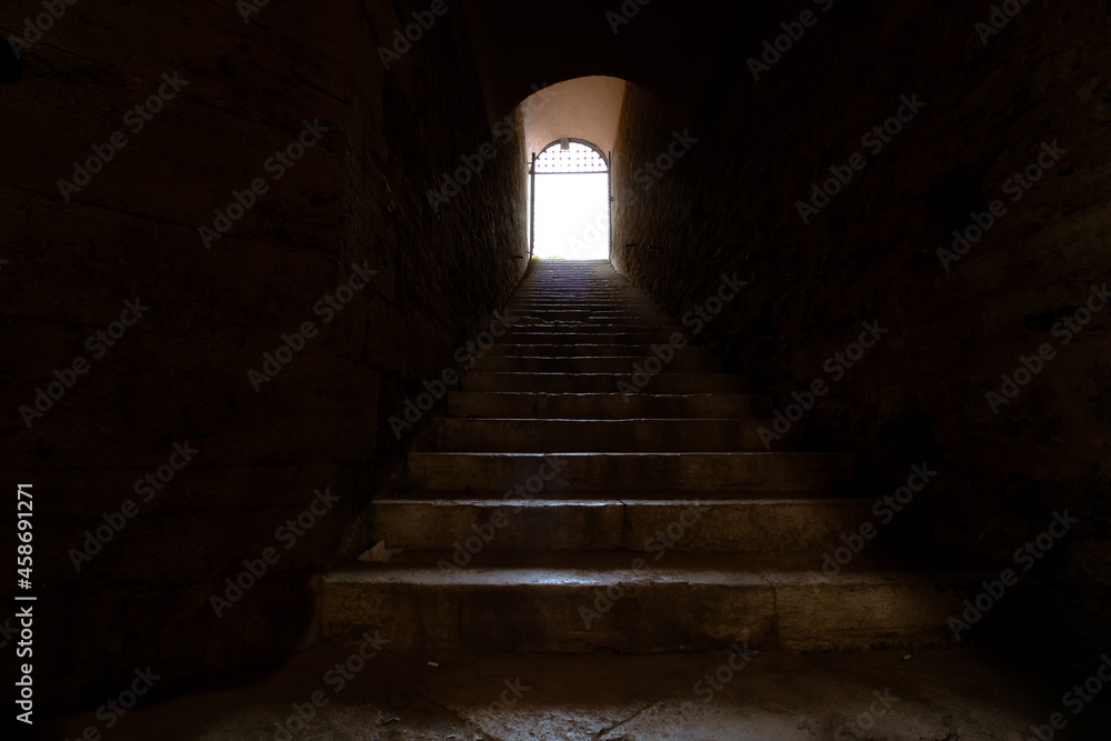 Stairs to the light. End of the tunnel. Afterlife concept. To the heaven concept