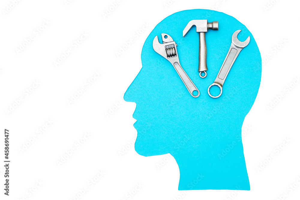 Human head profile with hand tools isolated on white Human head profile with hand tools isolated on white