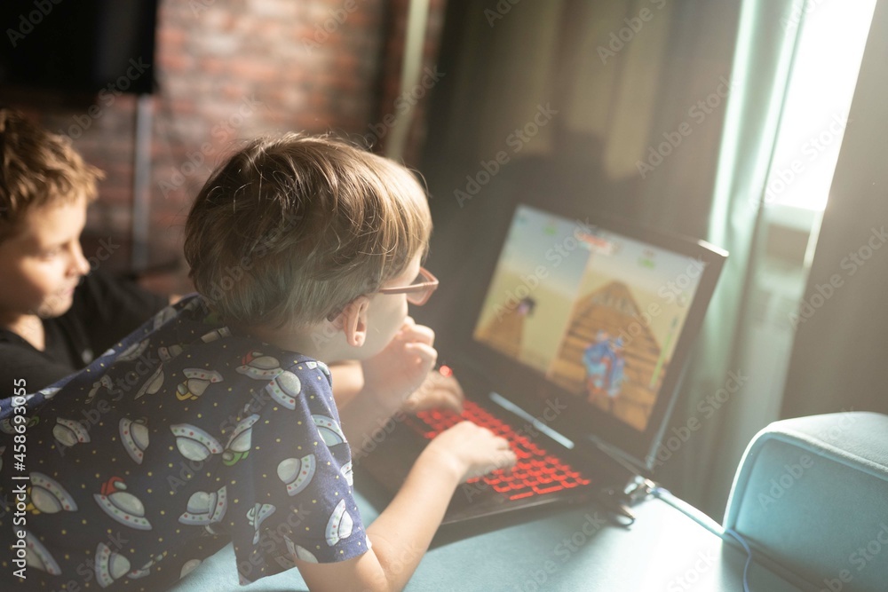 child playing video game child playing video game