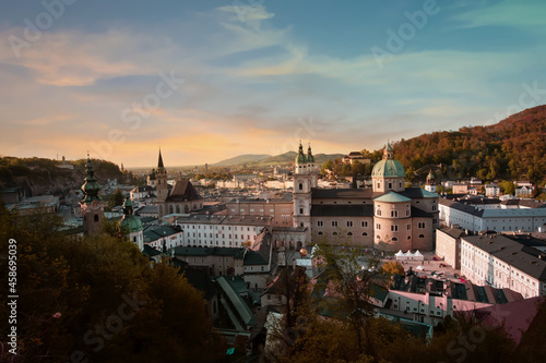 The Skyline view of old historic Fortress Hohensalzburg in the Autumn trees fall background in Salzburg, Austria
