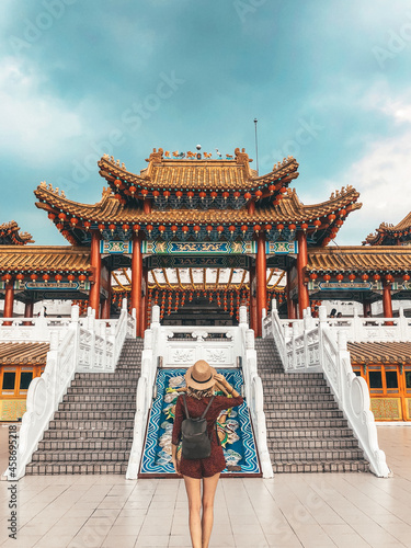 Photography Vertical shot of a woman enjoying the view of the Thean Hou Temple Kuala Lumpur,