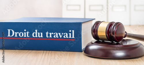 A law book with a gavel - Labour law in french - Droit du travail