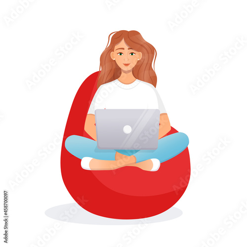 Woman sits on the bean bag chair and works at the computer. Remote work, office at home, programming, freelance. Study at home in quarantine. Vector illustration.