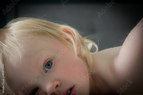 Happy toddler girl dancing indoors
