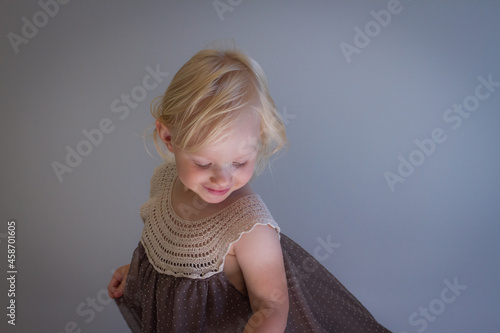 Happy toddler girl dancing indoors