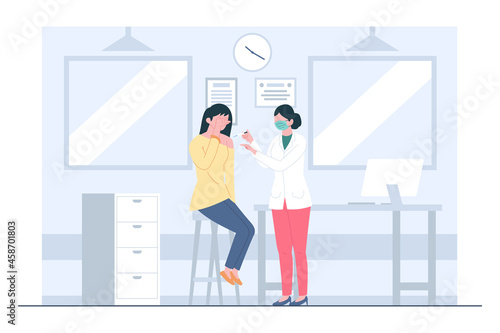 A woman getting vaccinated by nurses