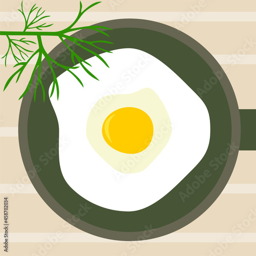 scrambled eggs on a plate with dill. Breakfast. Fried egg in a frying pan