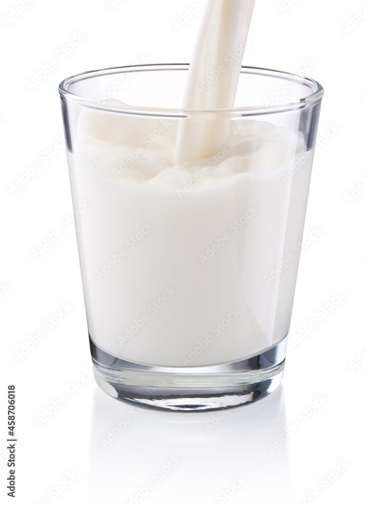 Pouring milk into glass isolated on white background
