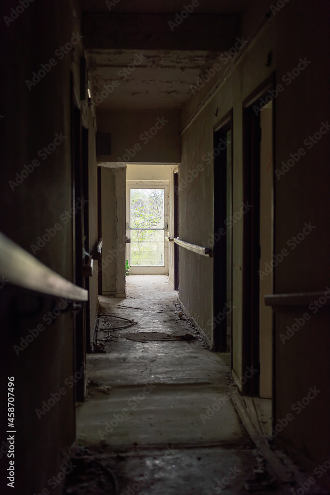Dilapidated dirty hallway in an abandoned care home.