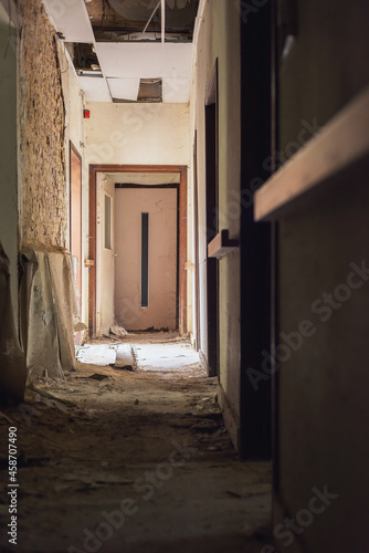Dilapidated dirty hallway in an abandoned care home. © ysbrandcosijn