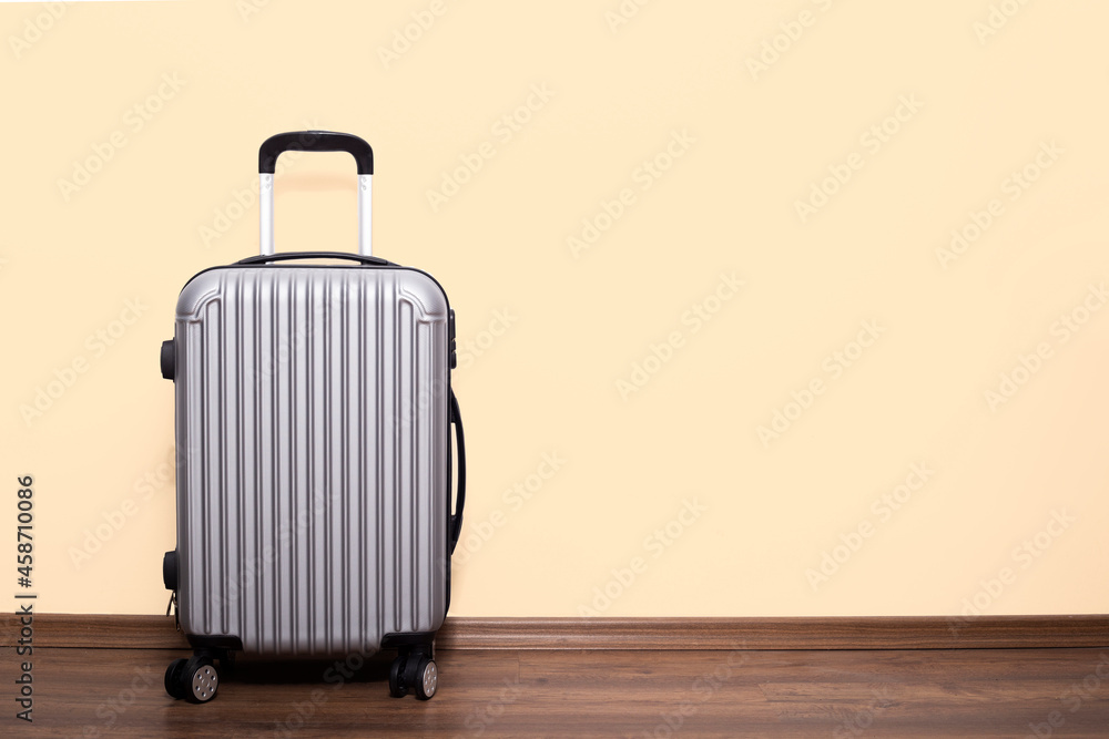 Packed suitcase near color wall. Travel concept Packed suitcase near color wall. Travel concept