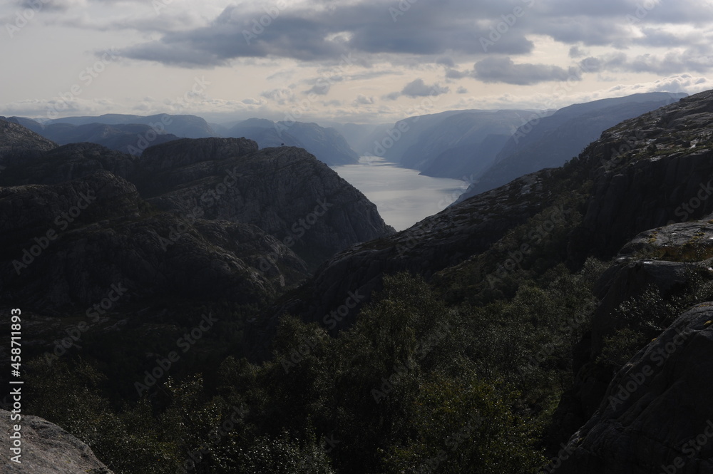 Dramatic panorama of Lysefjord (Lysefjorden) fjord canyon landscape in Norway on a cloudy day in summer 