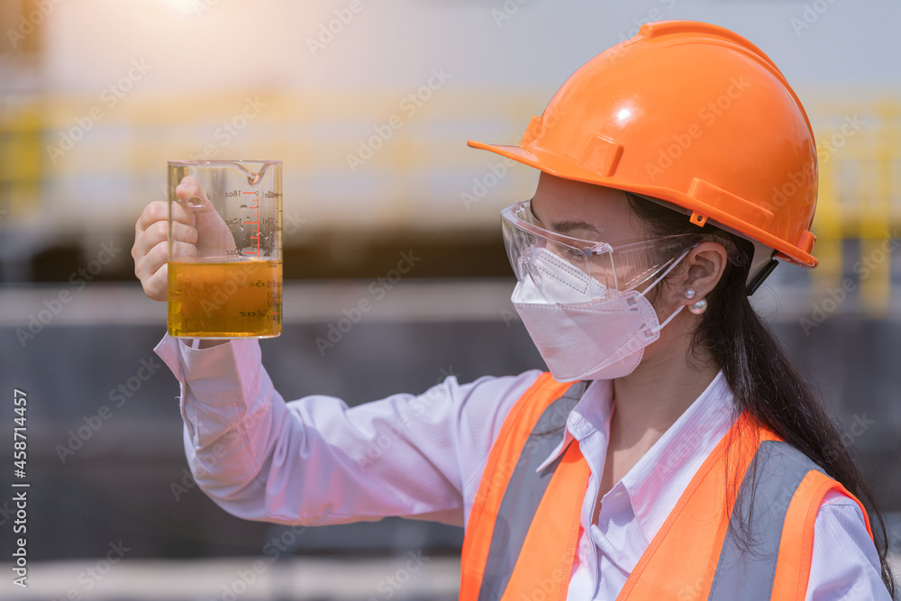 Worker under checking the waste water treatment pond industry large to control water support industry. Worker under checking the waste water treatment pond industry large to control water support industry.