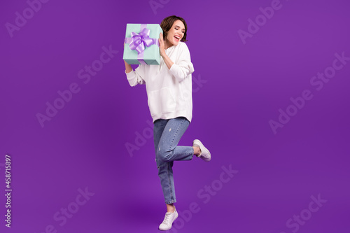 Full size photo of young pretty lovely girl celebrate birthday hold desire present isolated on purple color background