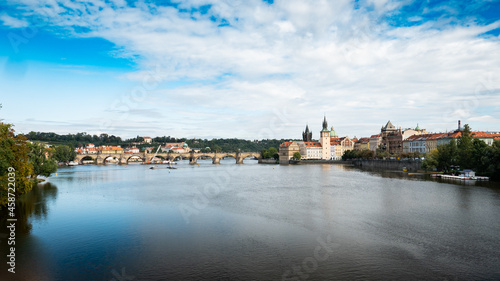 Prague, Czech Republic. A view over the Vlatava River with the landmark Charles Bridge and Old Town Bridge Tower visible in the distance.