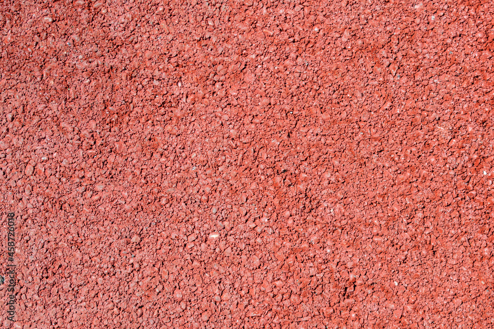 Fototapeta premium Close up of red asphalt road texture background