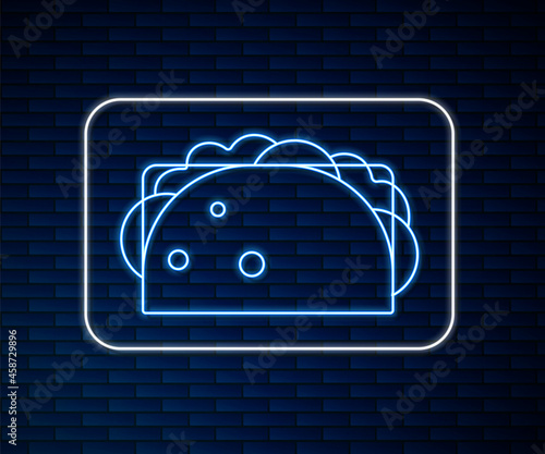 Glowing neon line Taco with tortilla icon isolated on brick wall background. Traditional mexican fast food menu. Vector