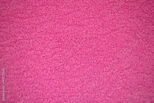 Pink sheep fur with a texture of fibers. Pattern soft canvas for various purposes