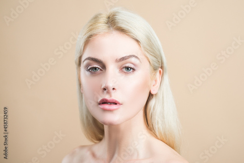 Natural beauty cosmetics. No makeup girl. Blonde woman portrait.